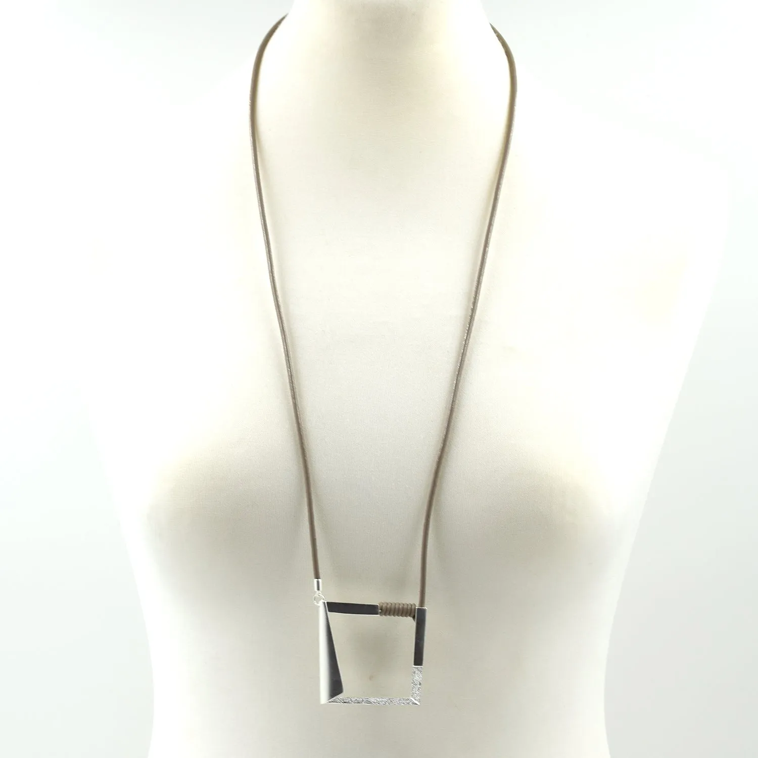 Contemporary cut our square pendant on long leather necklace