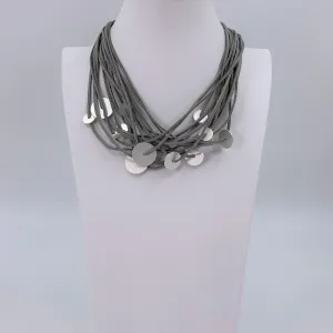 Disc elements on multi faux suede contemporary necklace