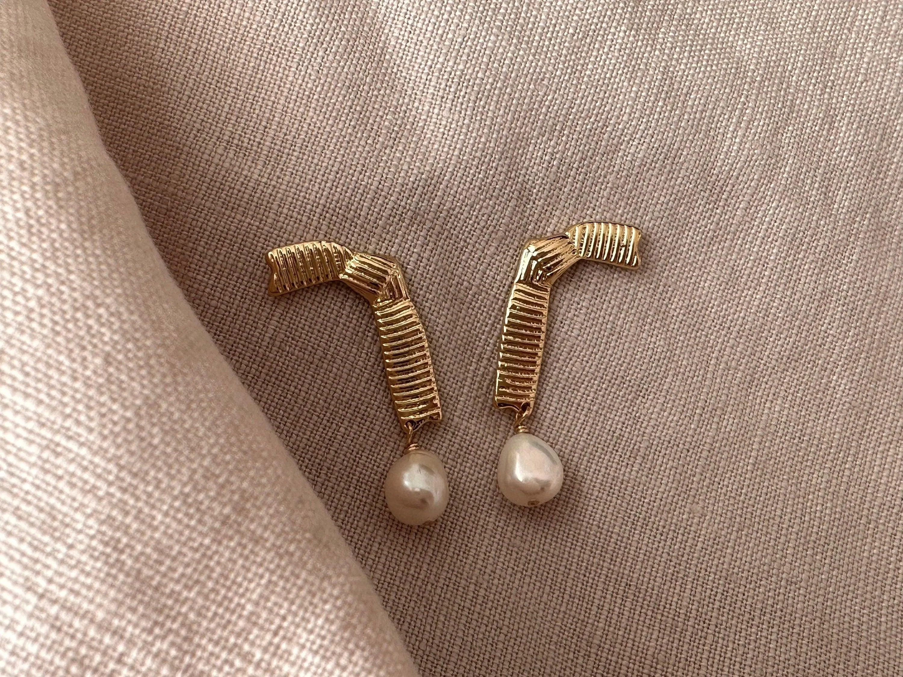 Stylish 14K gold plated asymmetrical earrings with pearl pendants